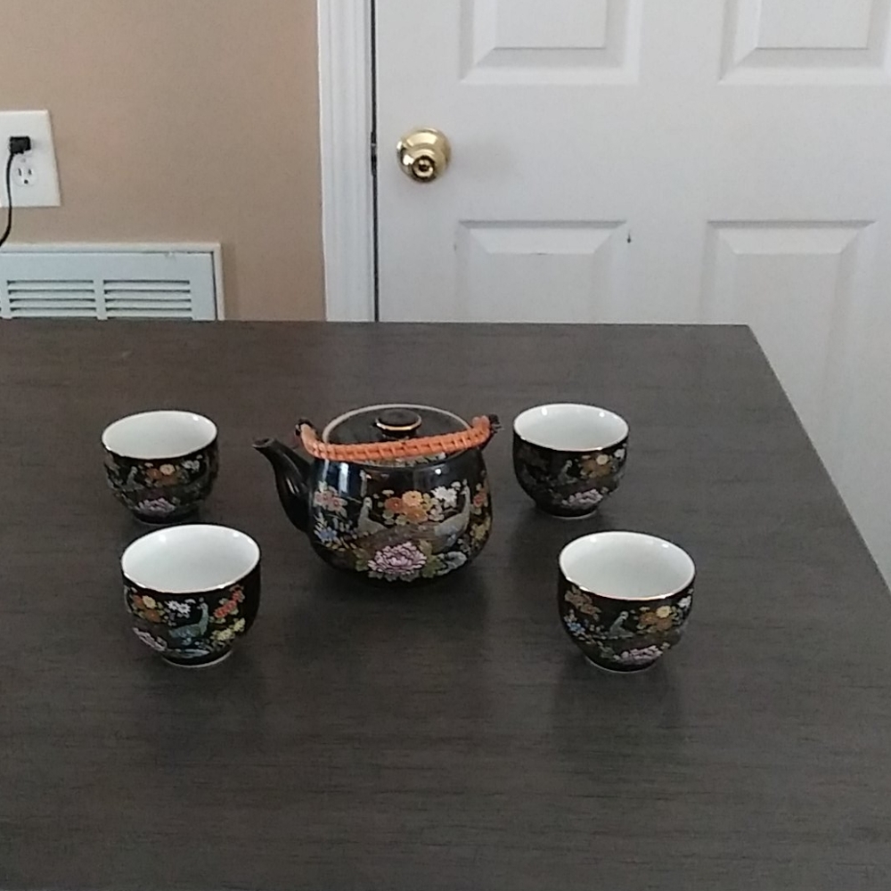 Tea pot and 4 cups.item sold